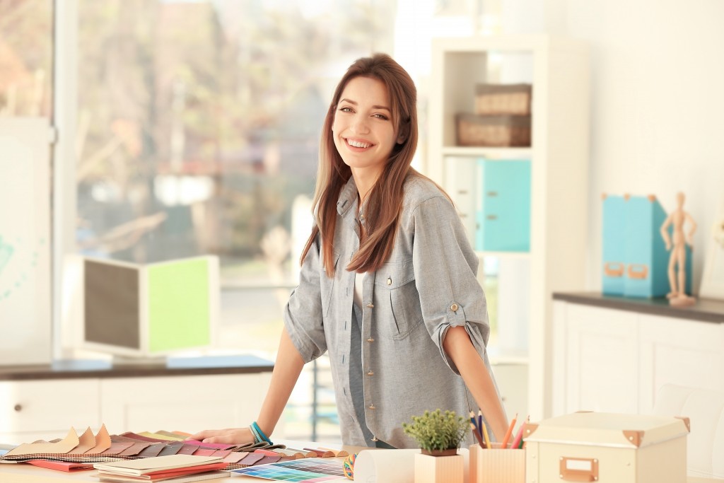 interior designer in her desk area