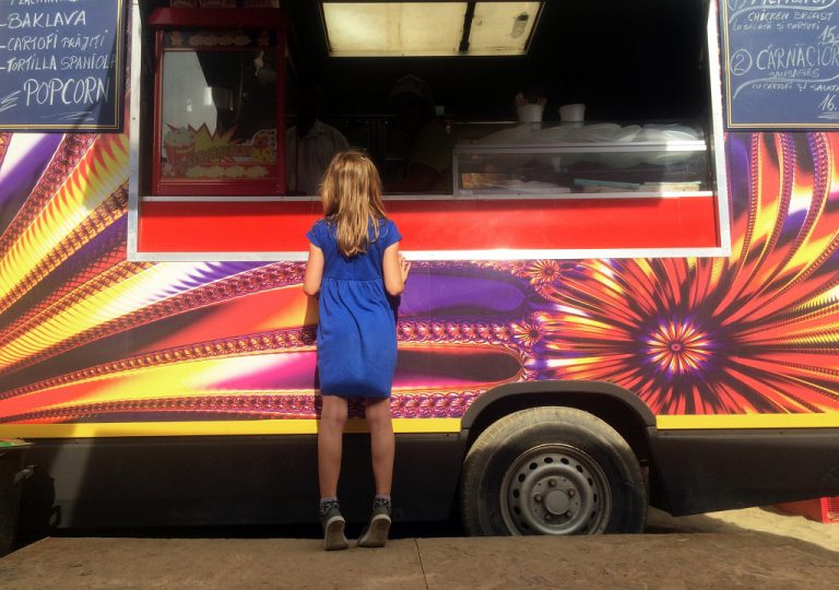 Girl in front of food truck