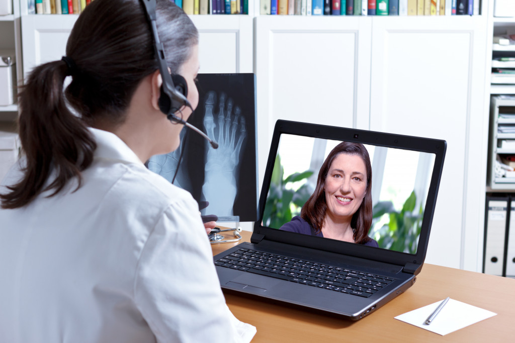 telemedicine. doctor talking to patient thru video conference