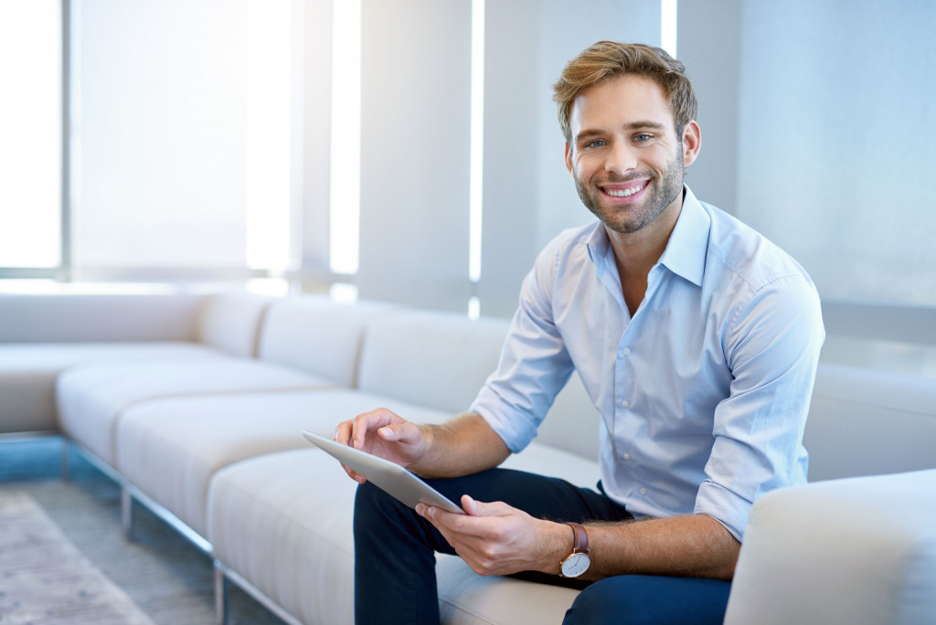 male business man sitting on a couch