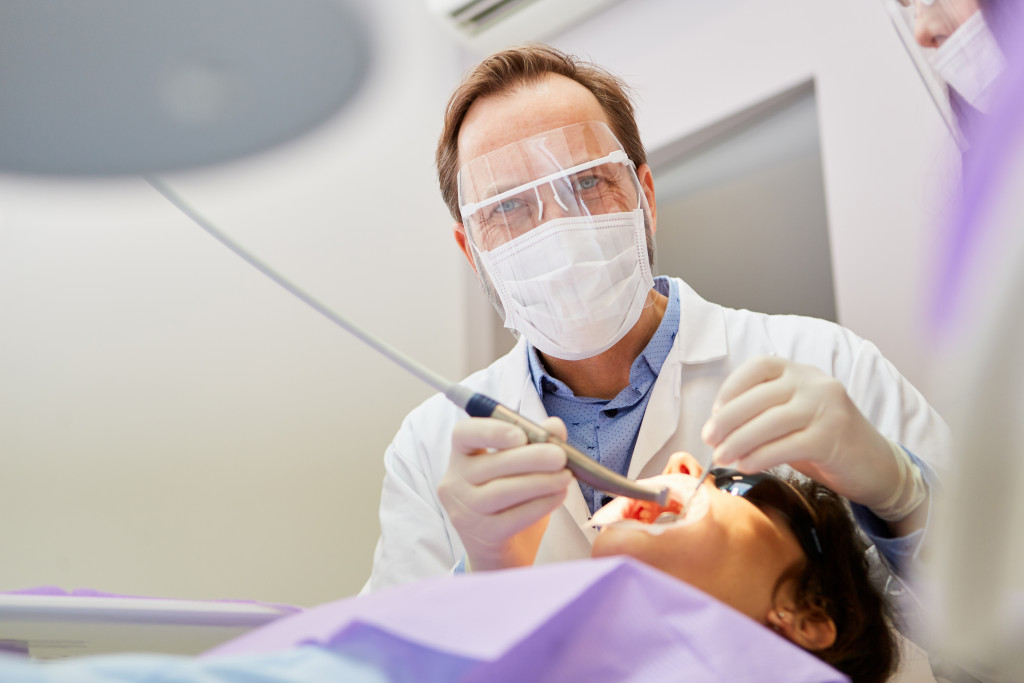 dentist with his patient