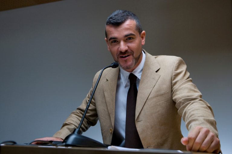 man standing in podium