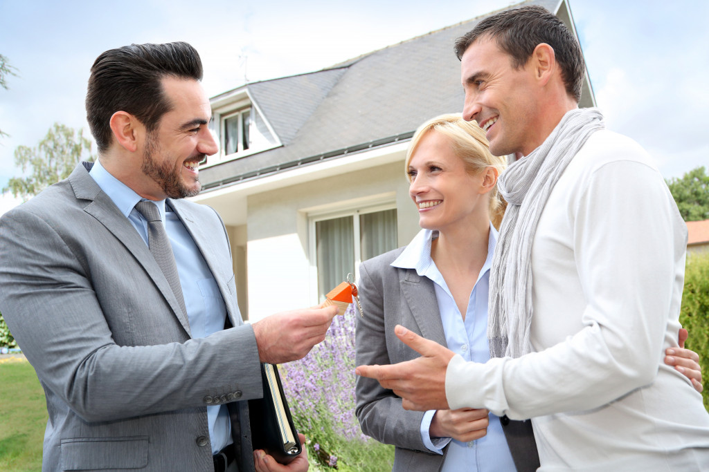 couple and real estate agent